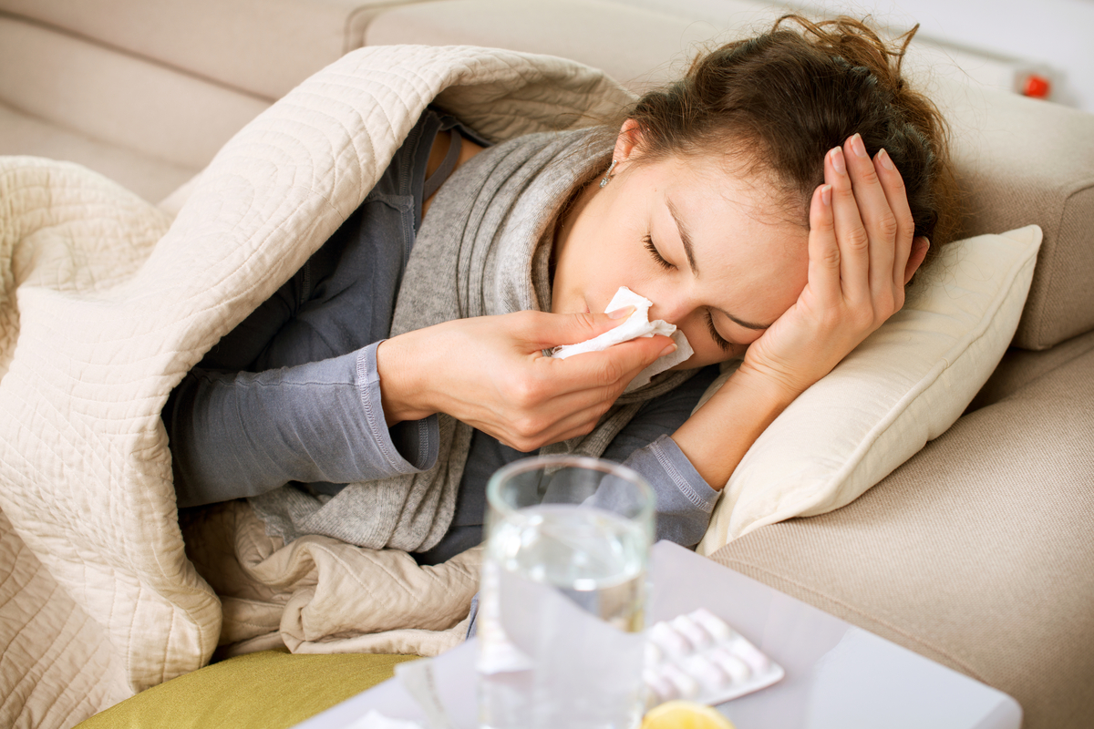 sick woman fighting off a cold